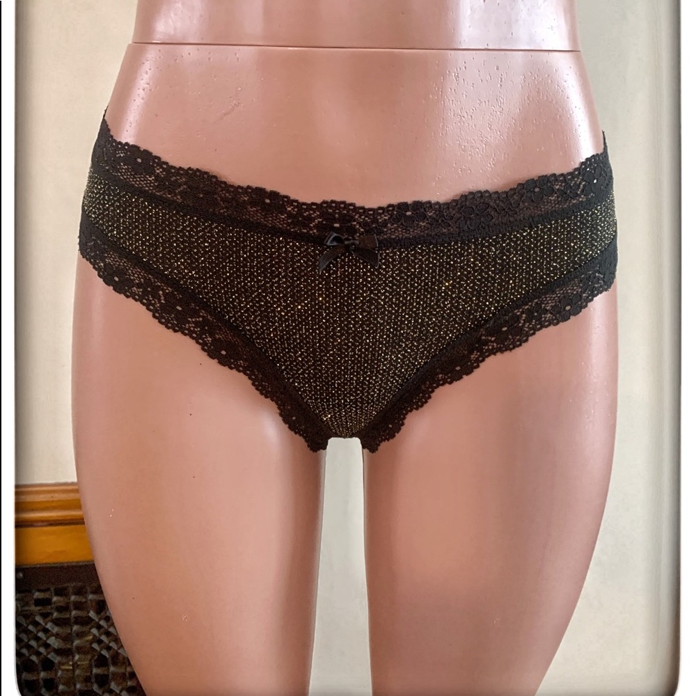 Victoria’s Secret black/gold thongs size M.